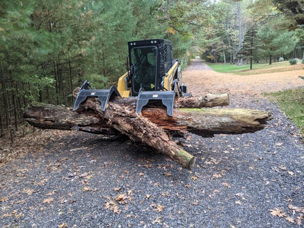 Removing logs with a skid steer